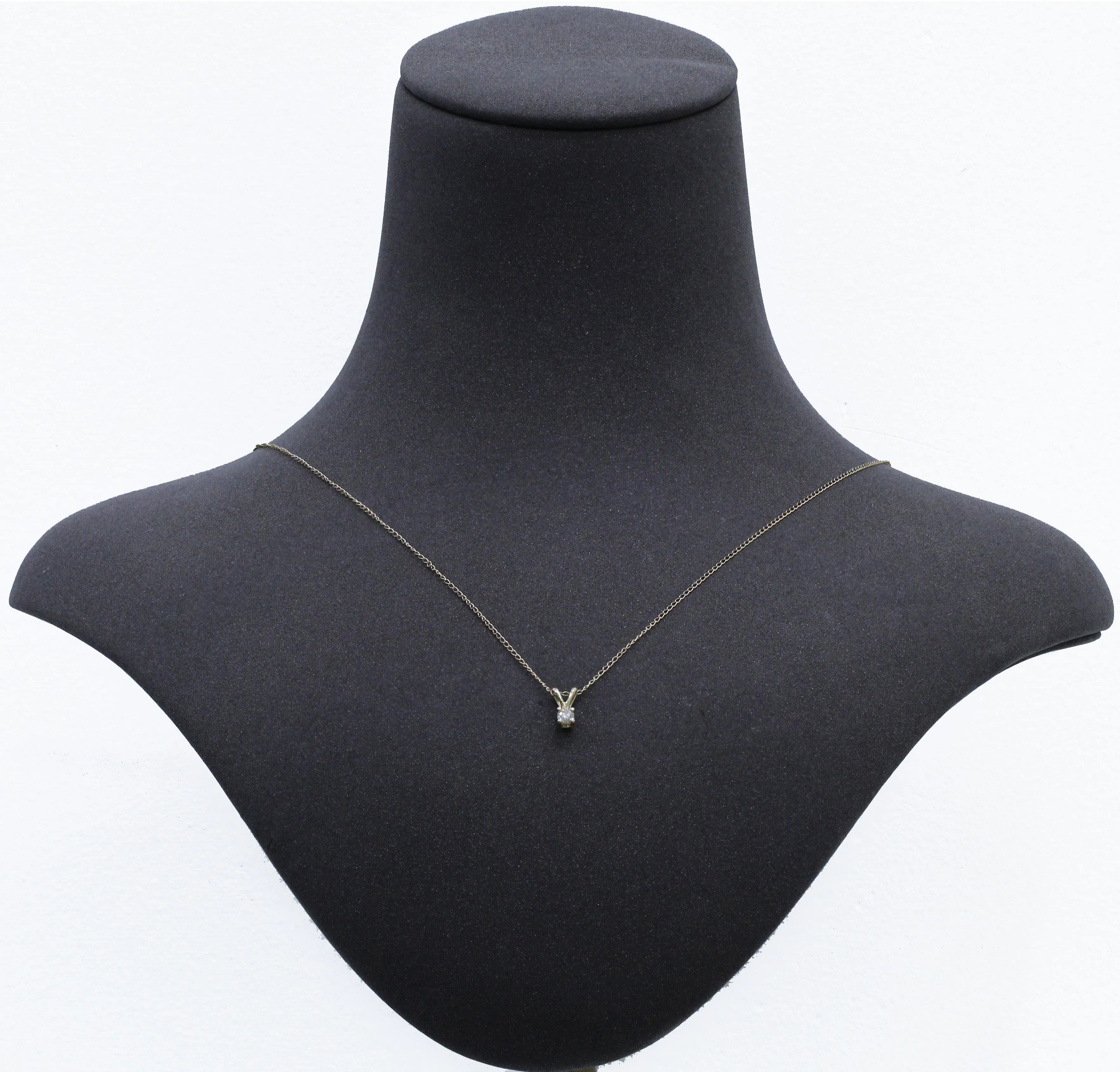 1/7 Carat Round Diamond Solitaire Pendant in 14K Yellow Gold