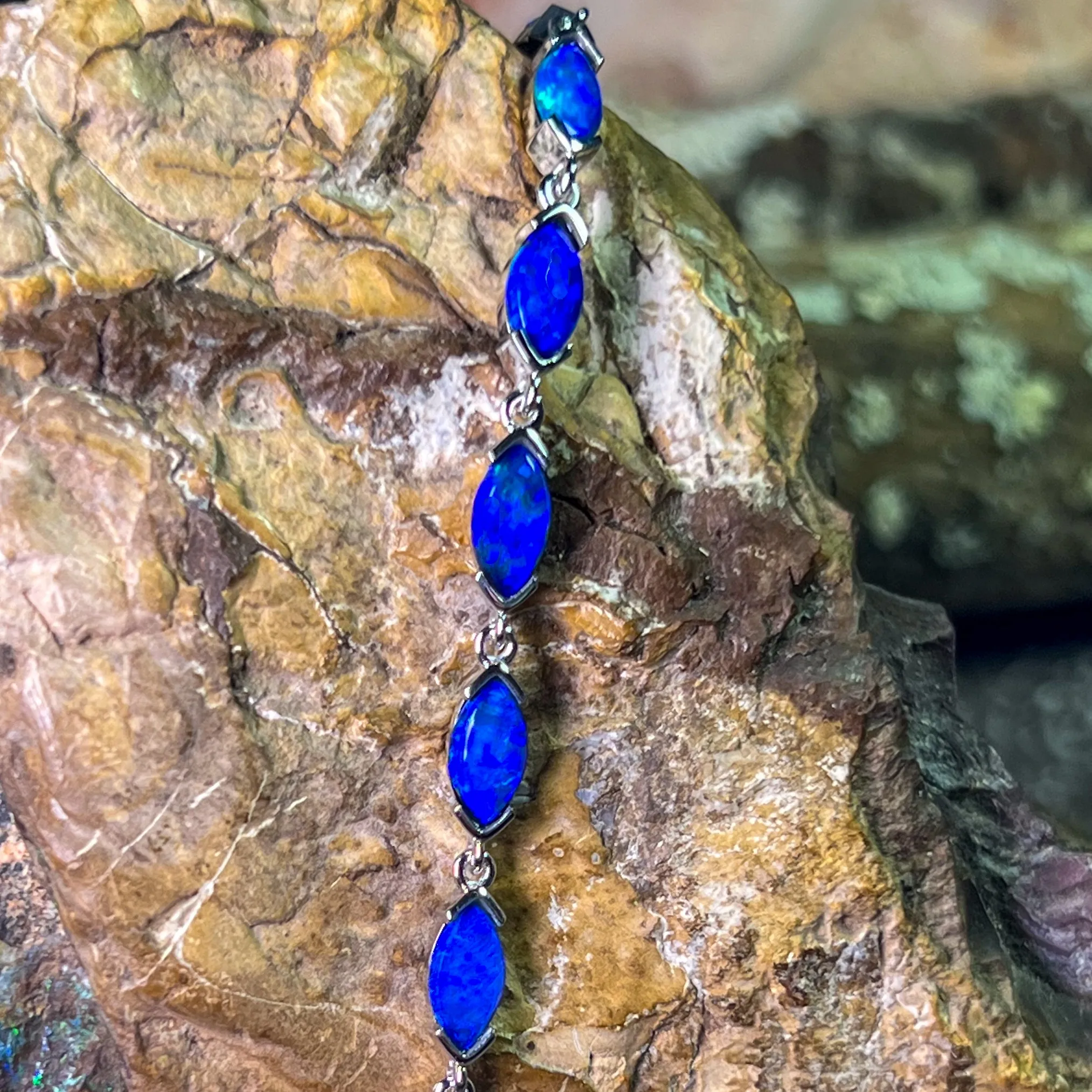 9kt White Gold Marquise Light Opals Blue closed backing bracelet V-claw