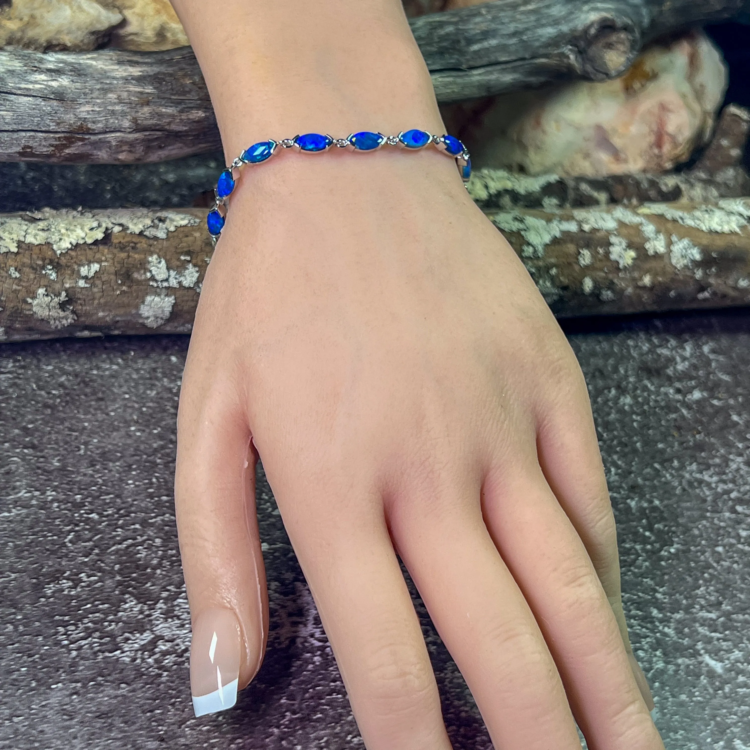 9kt White Gold Marquise Light Opals Blue closed backing bracelet V-claw