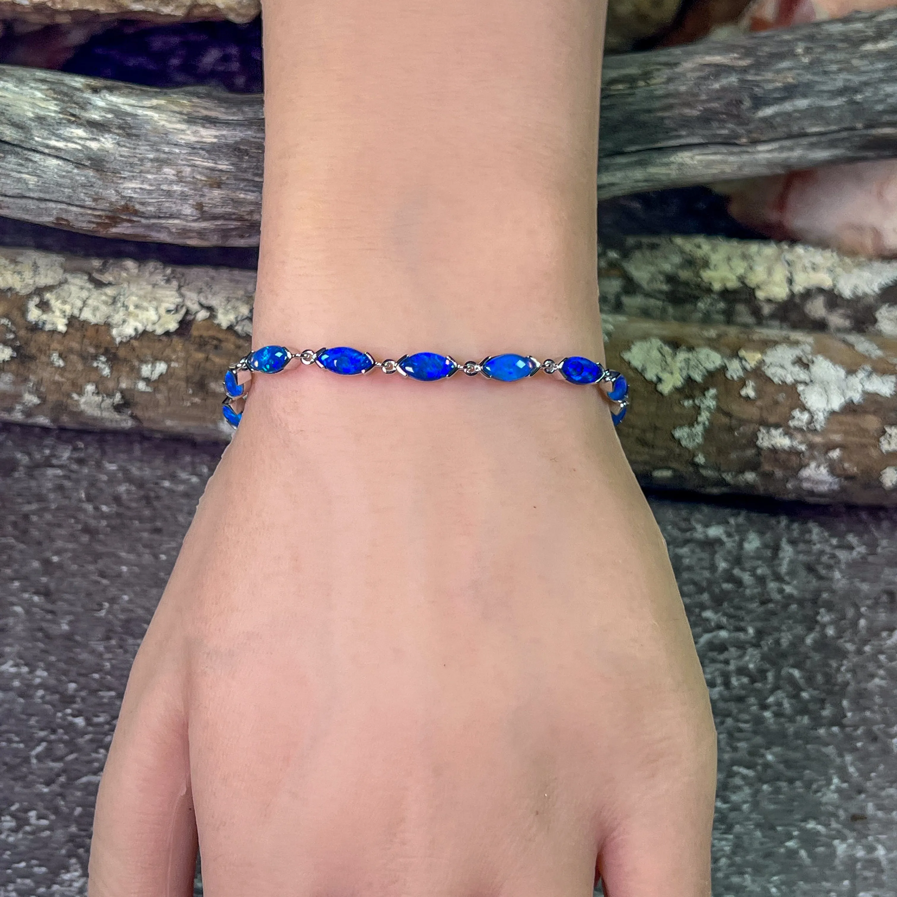 9kt White Gold Marquise Light Opals Blue closed backing bracelet V-claw