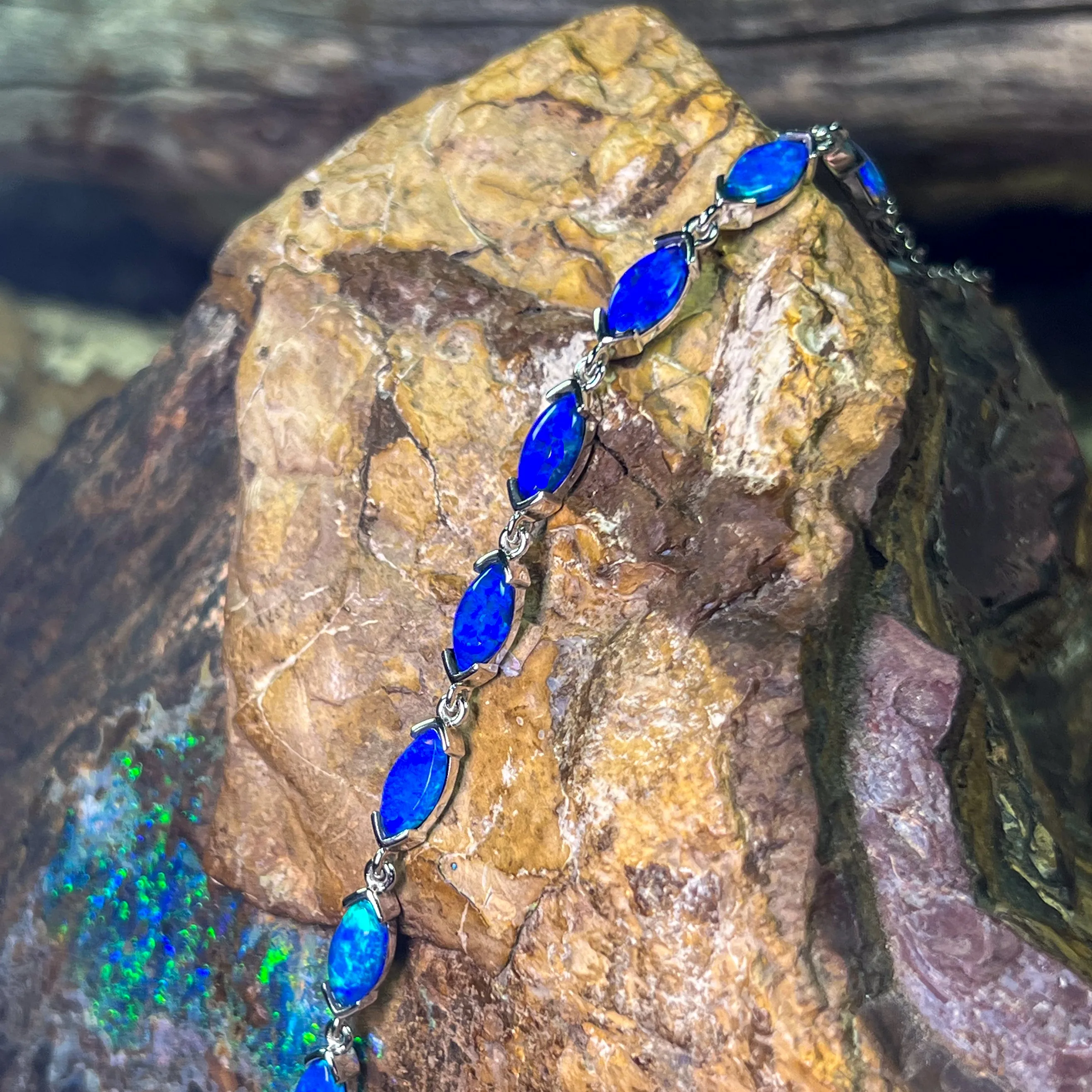 9kt White Gold Marquise Light Opals Blue closed backing bracelet V-claw