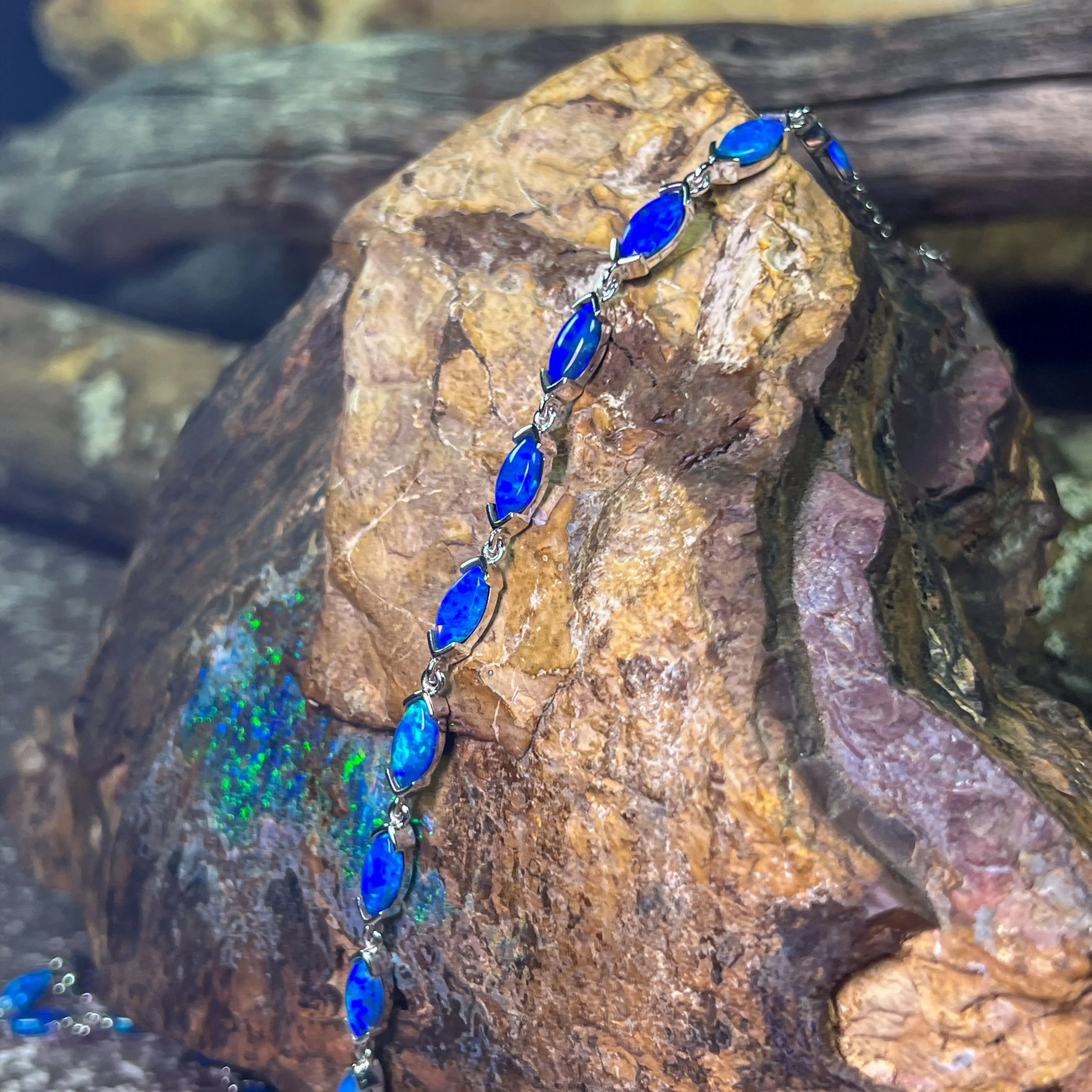 9kt White Gold Marquise Light Opals Blue closed backing bracelet V-claw