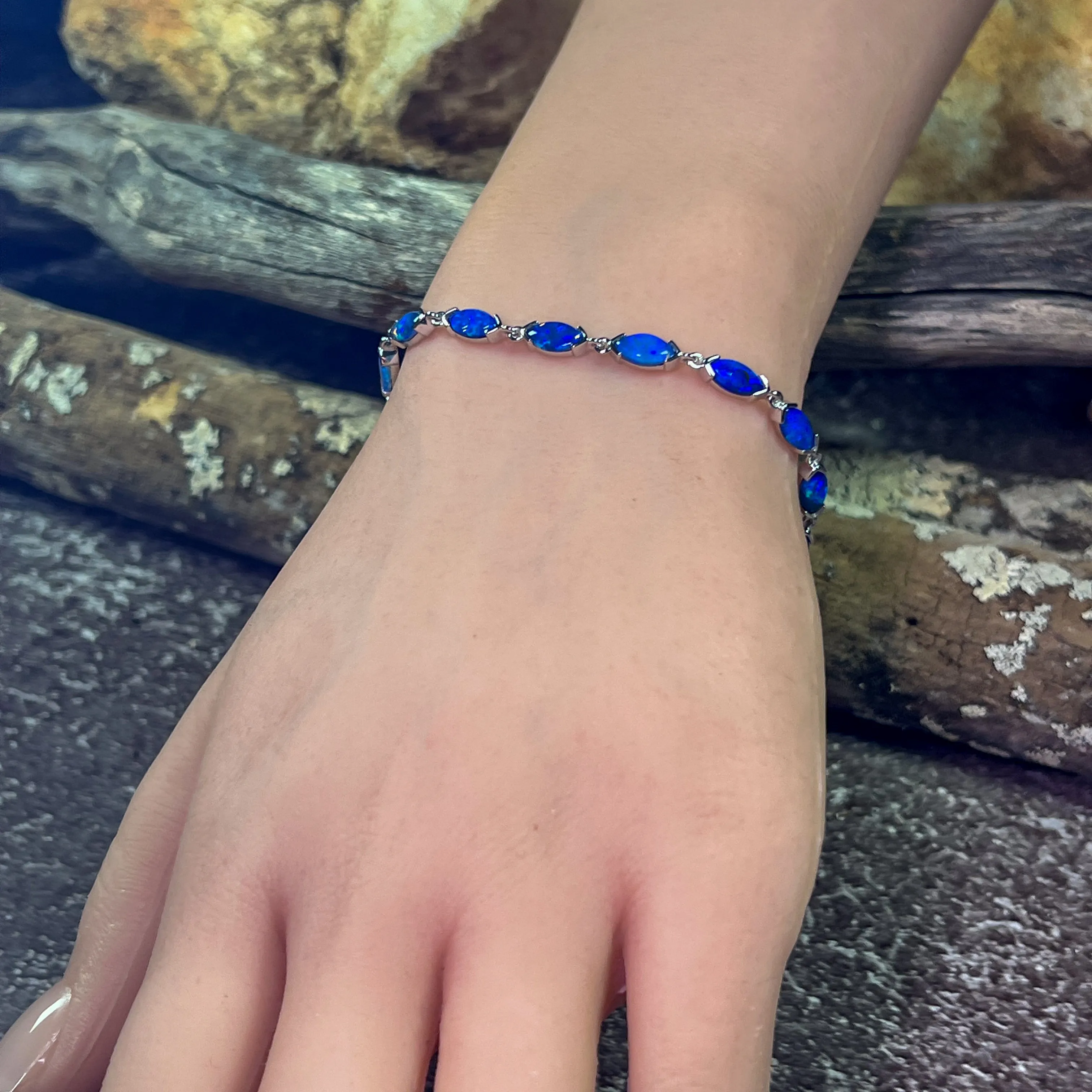 9kt White Gold Marquise Light Opals Blue closed backing bracelet V-claw