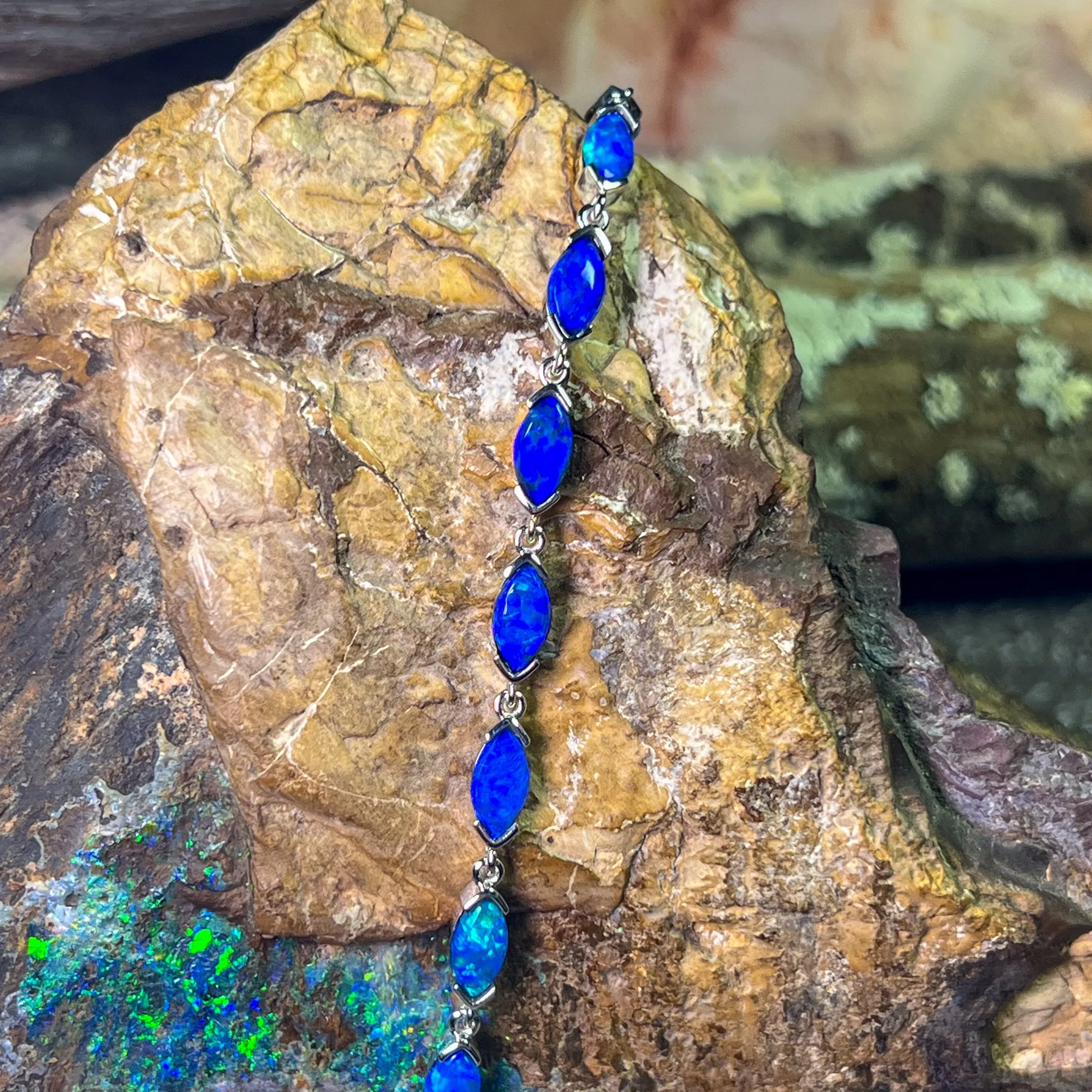 9kt White Gold Marquise Light Opals Blue closed backing bracelet V-claw