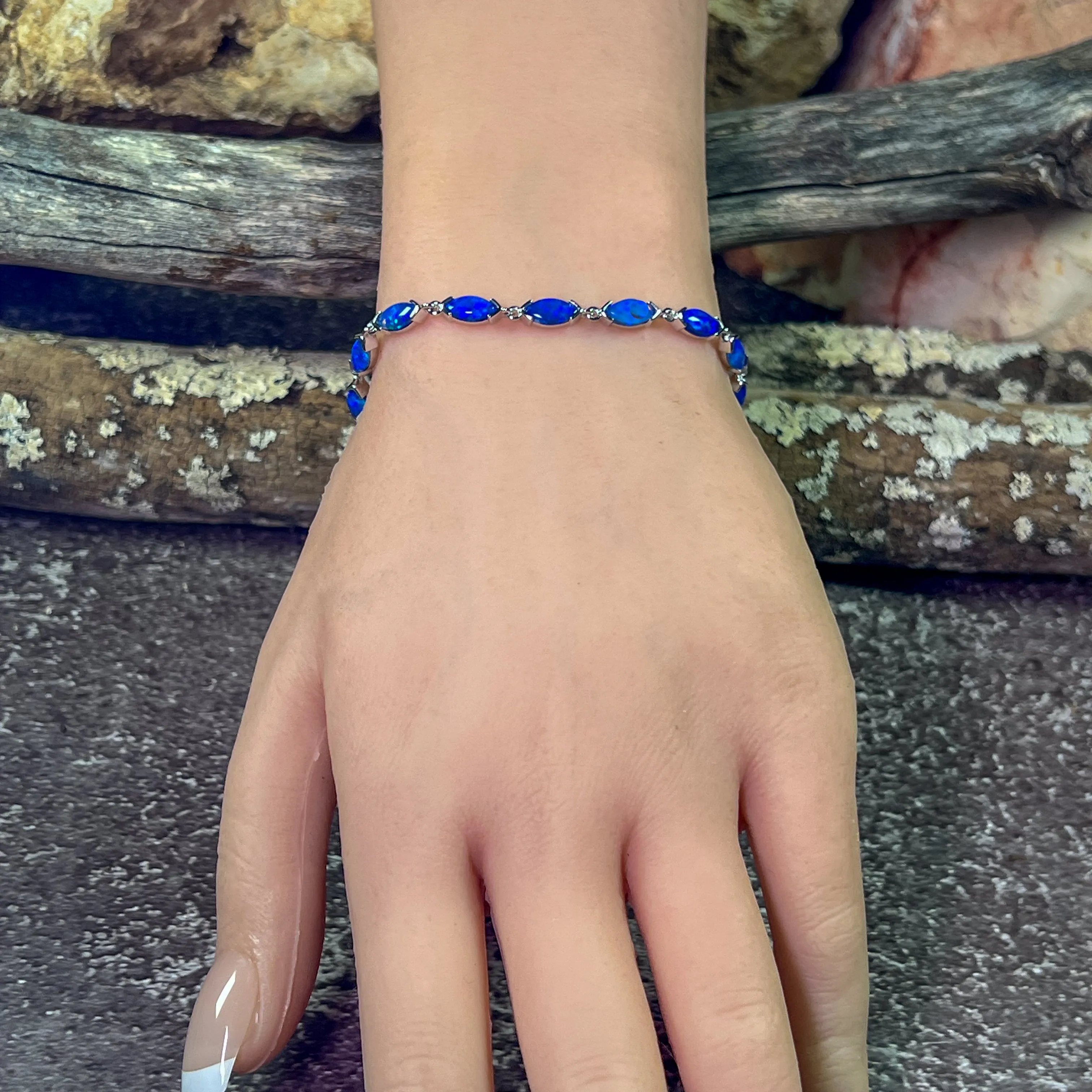 9kt White Gold Marquise Light Opals Blue closed backing bracelet V-claw