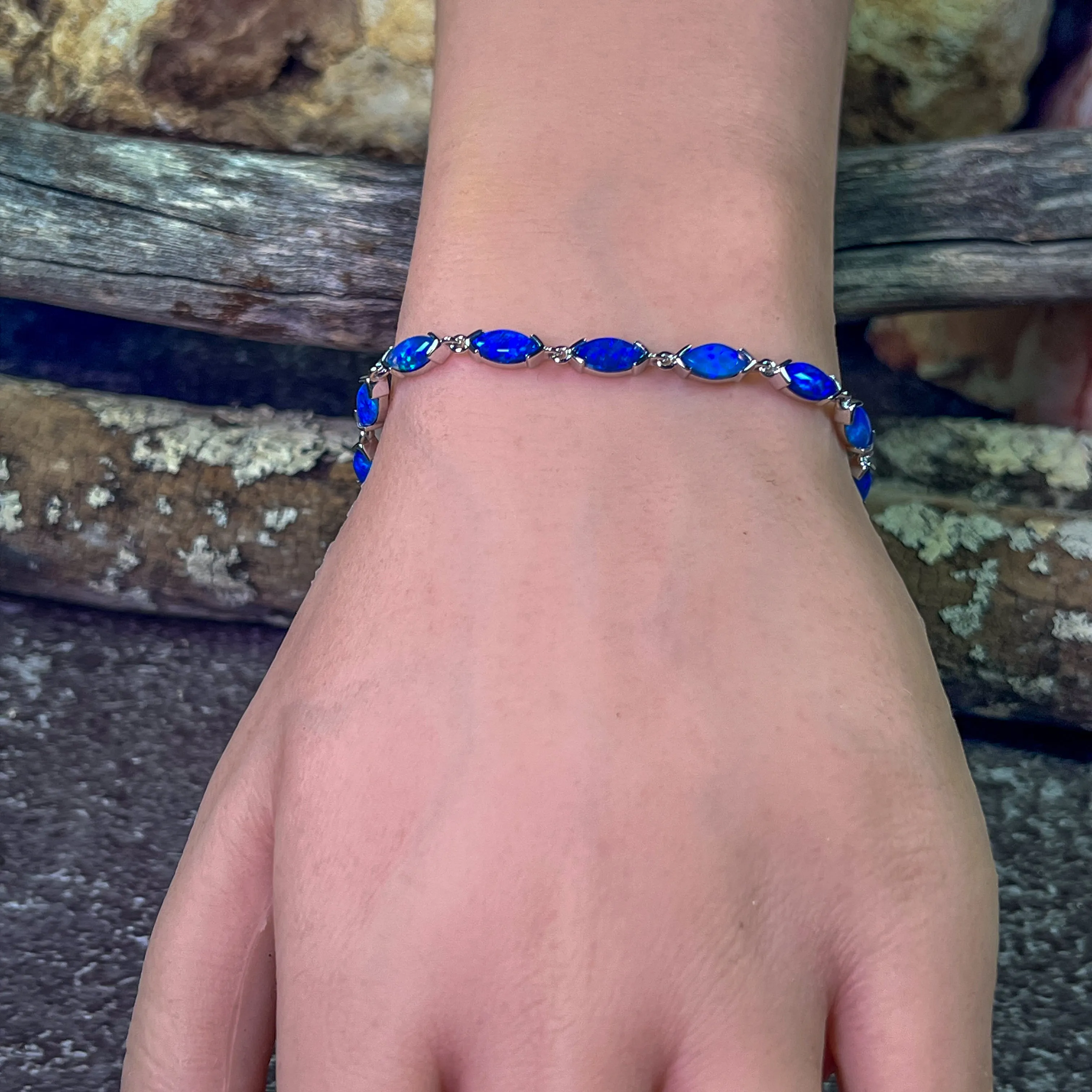9kt White Gold Marquise Light Opals Blue closed backing bracelet V-claw