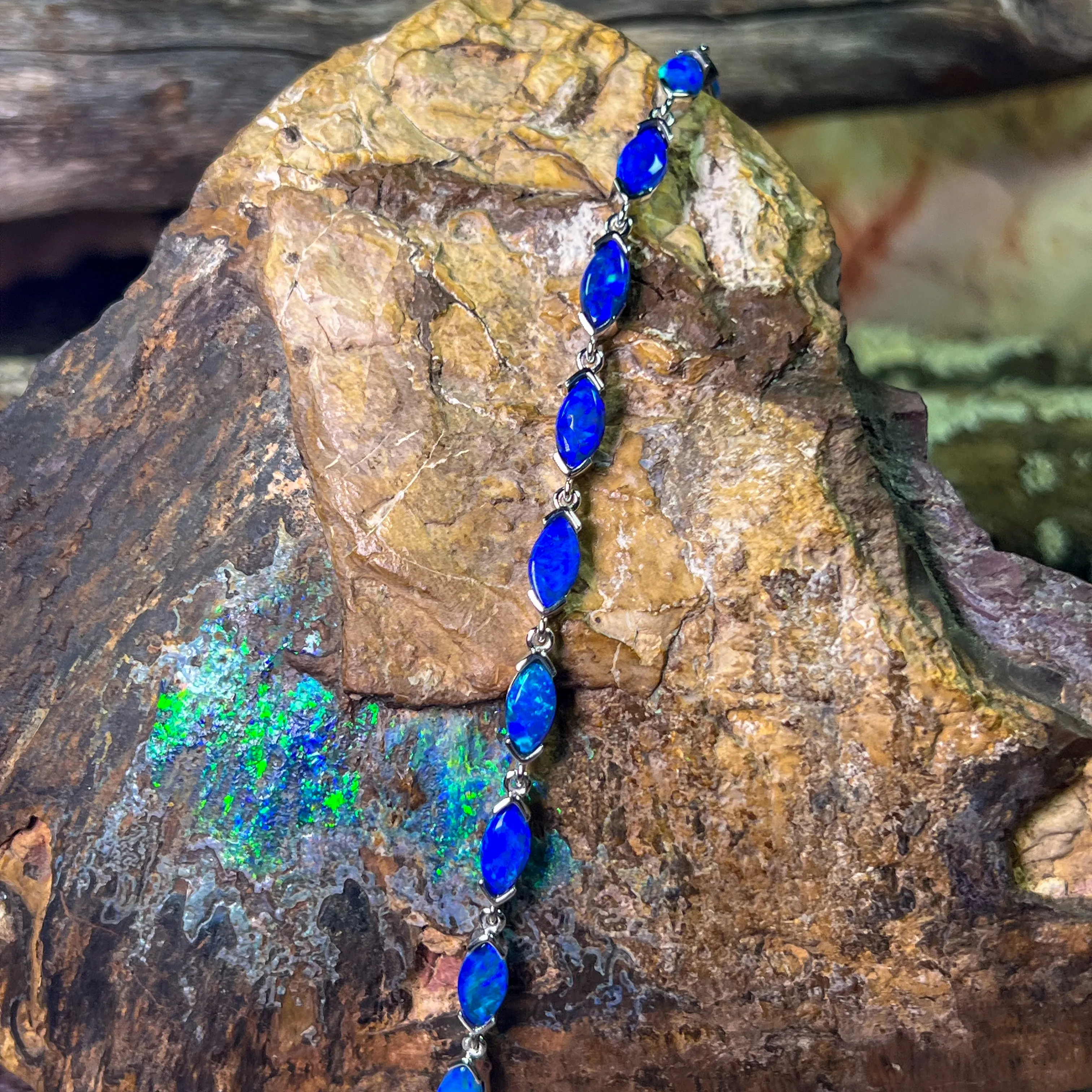 9kt White Gold Marquise Light Opals Blue closed backing bracelet V-claw