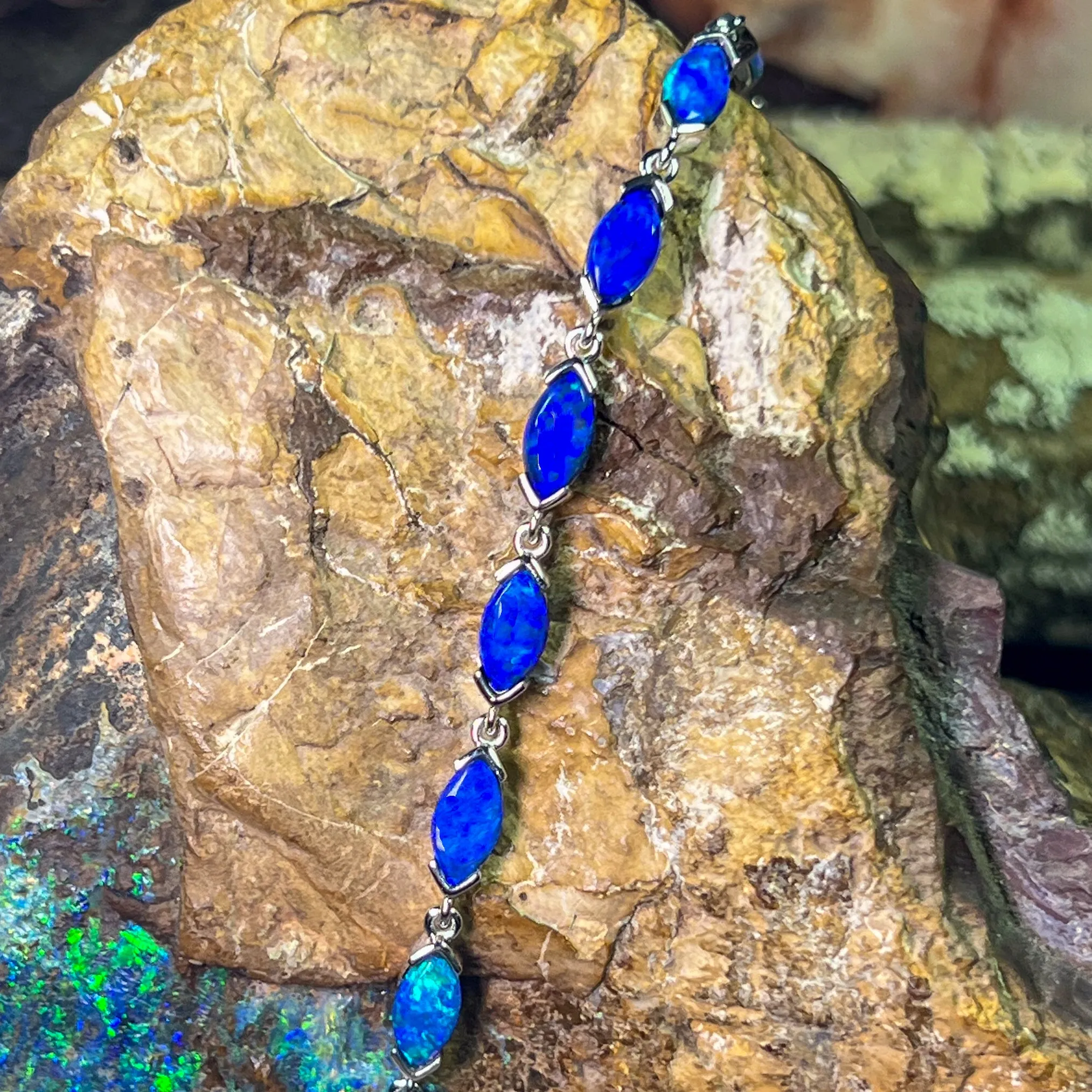 9kt White Gold Marquise Light Opals Blue closed backing bracelet V-claw