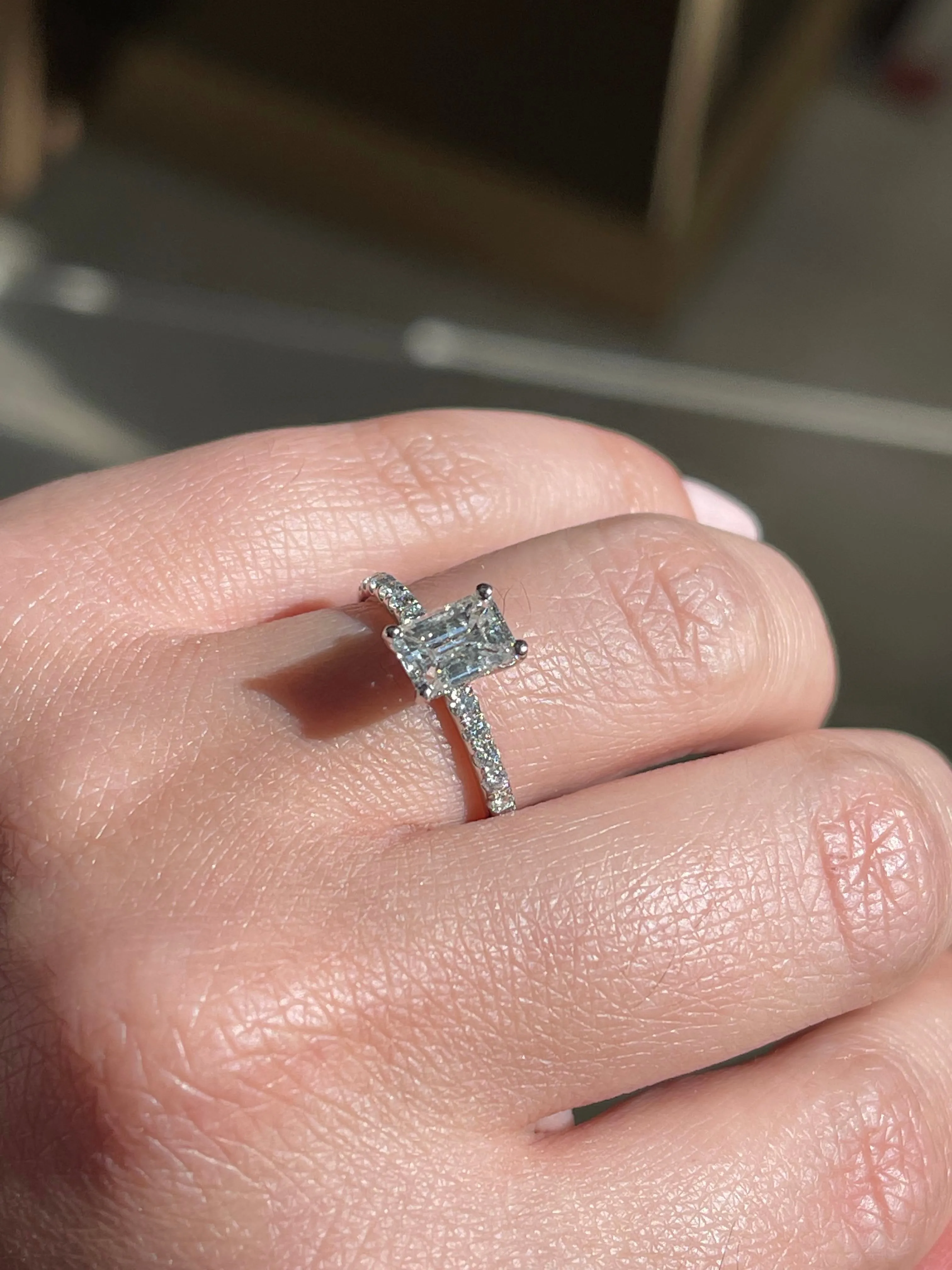 Modern Emerald Cut Solitaire Side-Diamond Engagement Ring