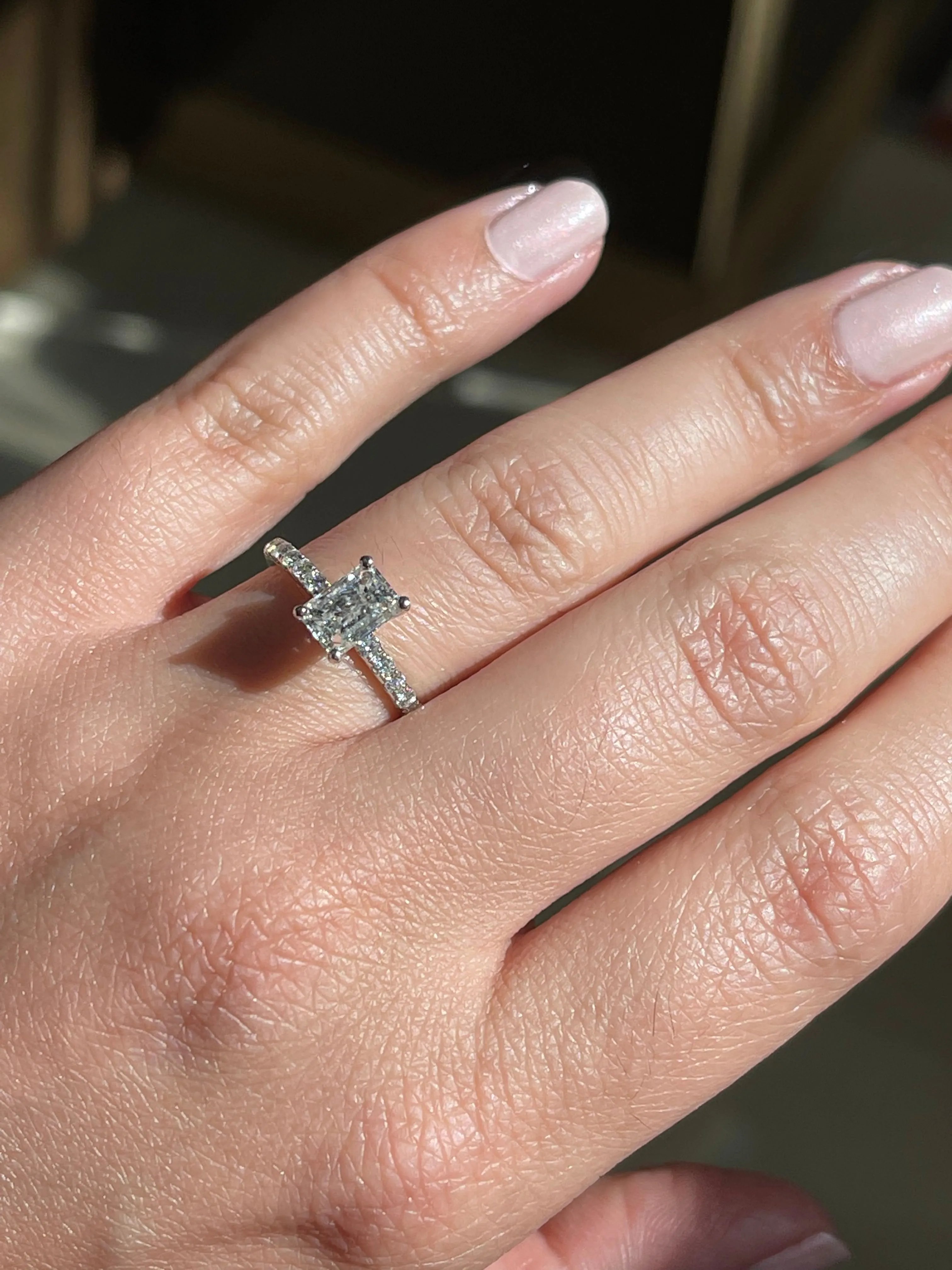 Modern Emerald Cut Solitaire Side-Diamond Engagement Ring