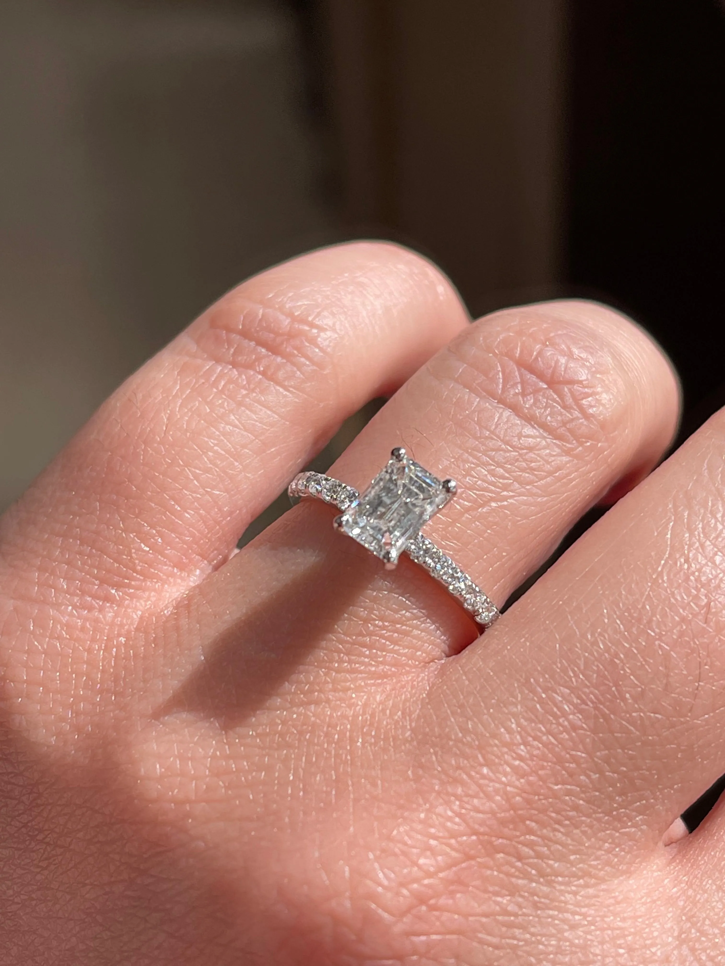 Modern Emerald Cut Solitaire Side-Diamond Engagement Ring